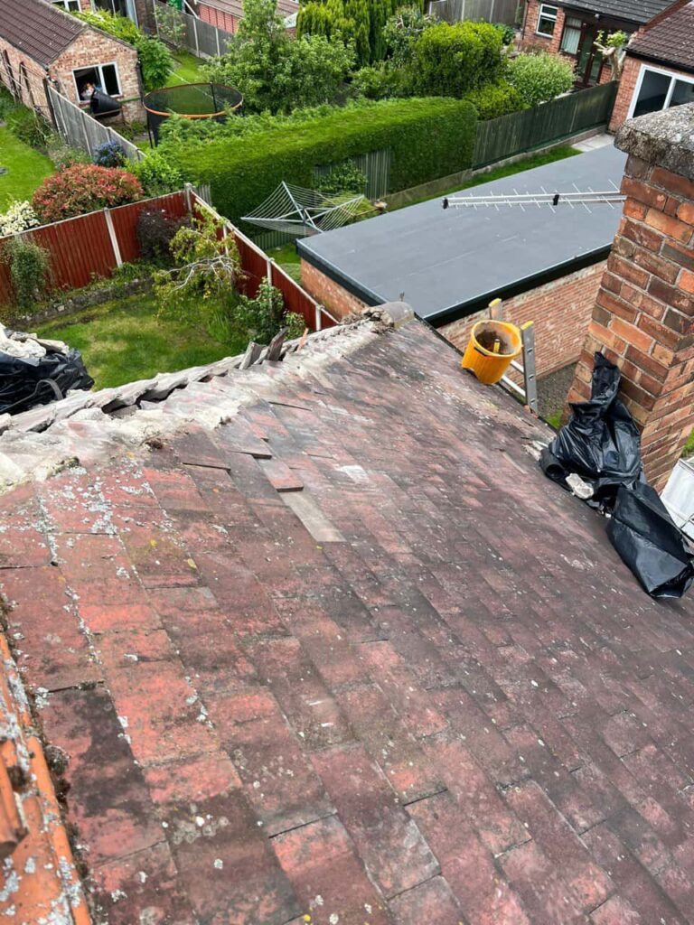 This is a photo of a roof where the hip tiles have been removed, and are just about to be replaced. Works carried out by Keyworth Roofing Repairs